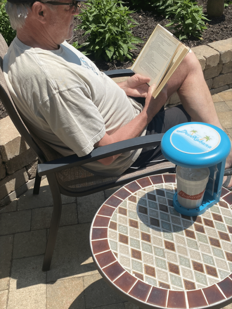 Man Reading Ourtdoors with DrinKabana Drink Shade